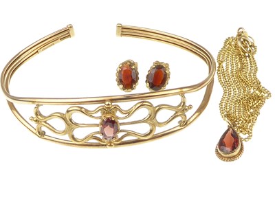 Lot 1051 - A 9ct gold half hoop bracelet with claw set...
