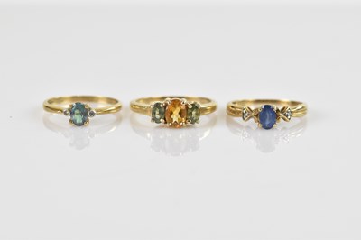 Lot 629 - Three 9ct yellow gold rings, each with...