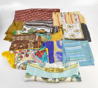 Lot 1229 - A collection of silk scarves, including two...
