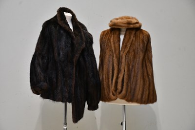 Lot 1233 - A light brown mink fur stole with front arm...