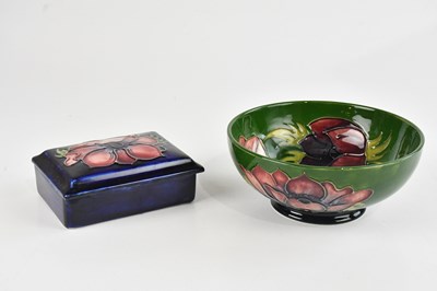Lot 297 - MOORCROFT; a 'Hibiscus' pattern trinket box...
