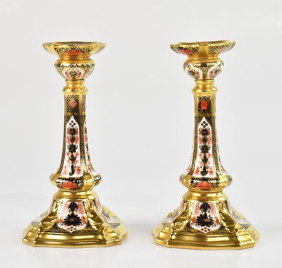 Lot 235 - ROYAL CROWN DERBY; a pair of candlesticks in...