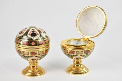 Lot 227 - ROYAL CROWN DERBY; two limited edition globe...