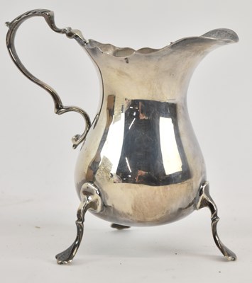 Lot 1165 - An Elizabeth II hallmarked silver cream jug,...