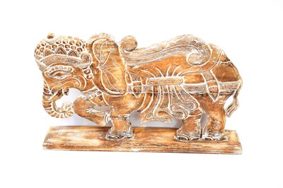 Lot 737 - A large flat wooden sculpture of a decorated...