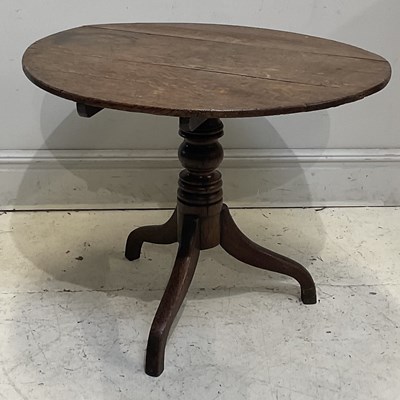 Lot 1174 - A George III provincial oak tripod table, with...
