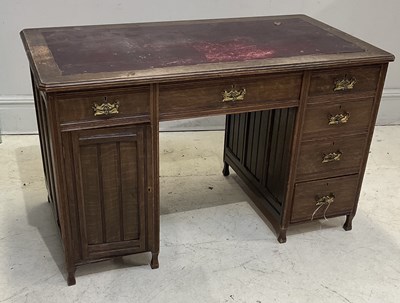 Lot 1121 - An Edwardian oak pedestal desk, with six...