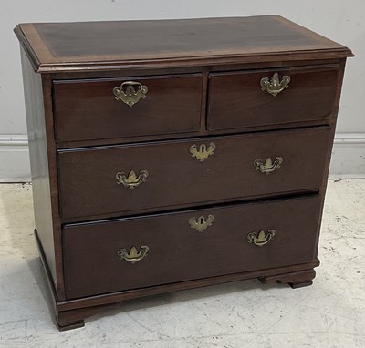 Lot 1123 - A George III mahogany chest, with two short...