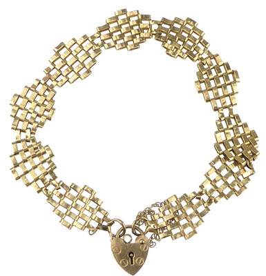 Lot 982 - A 9ct gold gate bracelet with lozenge-shaped...