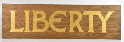 Lot 1297 - LIBERTY; an original large wooden shop sign...