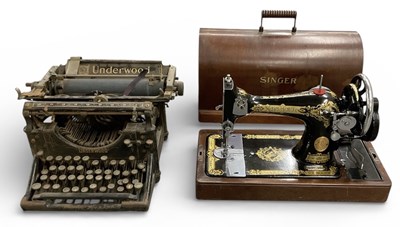 Lot 324 - SINGER; a cased early 20th century sewing...