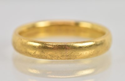 Lot 1216 - A 22ct yellow gold band ring, size R, approx 6....