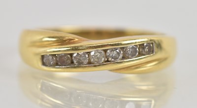 Lot 1233 - An 18ct yellow gold diamond set ring, set with...