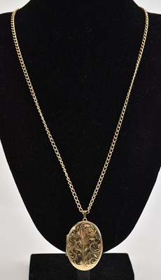 Lot 1321 - A large 9ct yellow gold oval locket pendant,...