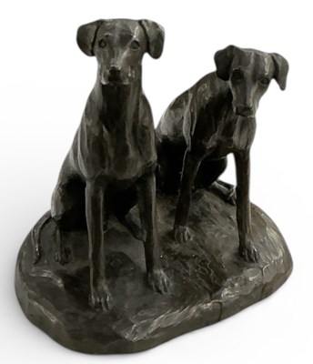 Lot 609 - A modern bronzed resin figure of two seated...
