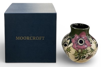 Lot 526 - MOORCROFT: a squat vase decorated in the...