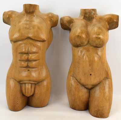 Lot 739 - Two carved wooden torsos, male and female,...