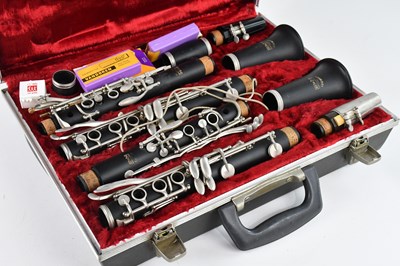 Lot 1398 - BOOSEY & HAWKES; two cased clarinets, stamped '...