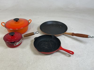 Lot 106 - LE CREUSET: cast iron cookware comprising two...