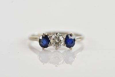 Lot 326 - A white metal diamond and sapphire three stone...