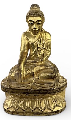 Lot 1095 - A late 19th/early 20th century Tibetan carved...