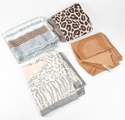Lot 1274 - TED BAKER; four scarves comprising a pink and...