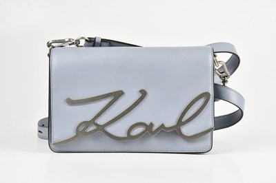 Lot 1513 - KARL LAGERFELD; a light blue crossbody...