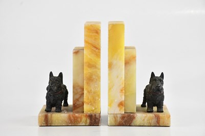 Lot 1179 - A pair of Art Deco alabaster and cold painted...