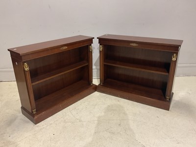 Lot 34 - A pair of reproduction mahogany Egyptian...