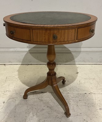 Lot 43 - A reproduction satinwood drum table, height...