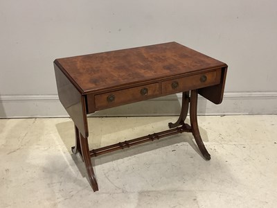 Lot 80 - A reproduction yew wood two drawer sofa table,...