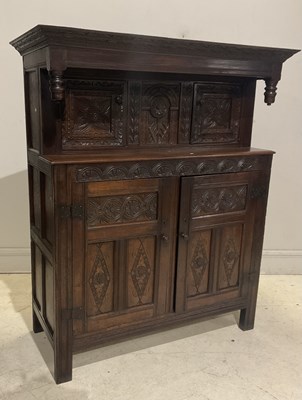 Lot 32 - An 18th century style carved oak court...