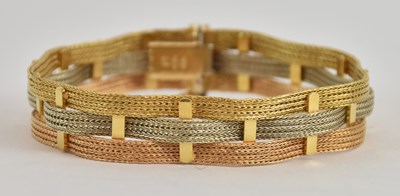 Lot 1400 - An 18ct tricolour gold semi-rigid woven...