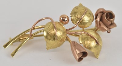 Lot 1388 - A 14ct yellow and rose gold floral spray...