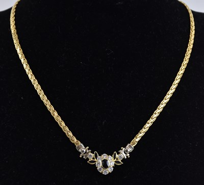 Lot 1313 - An 18ct yellow gold sapphire and white stone...