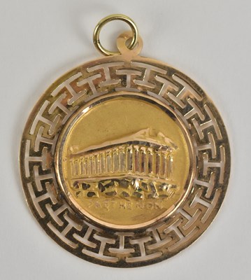 Lot 1340 - A yellow metal circular pendant, with central...