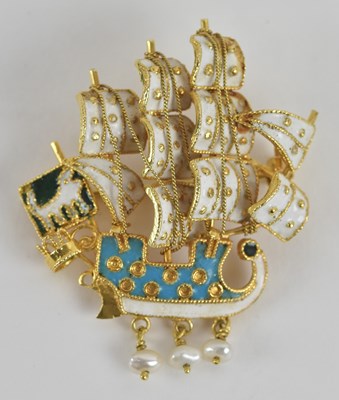 Lot 1383 - A yellow metal enamelled brooch modelled as a...