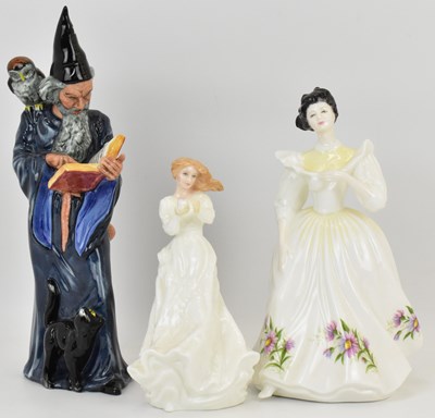 Lot 686 - ROYAL DOULTON; three porcelain figures...