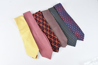 Lot 1235 - HERMÈS, PARIS; a navy blue 100% silk tie, with...