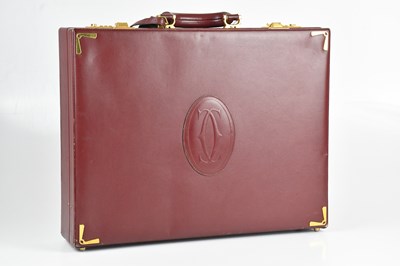 Lot 1184 - CARTIER; a Must de Cartier signature bordeaux...