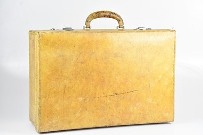 Lot 1295 - A 1950s rigid board tan leatherette suitcase,...