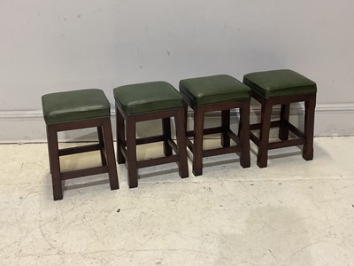 Lot 182 - Four oak framed stools with green leather tops,...