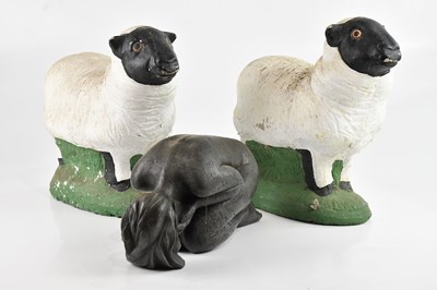 Lot 1211 - A decorative bronzed figure of a crouching...