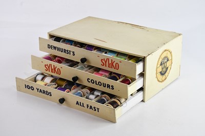 Lot 260 - SYLKO; a Dewhurst's Sylko three drawer sewing...