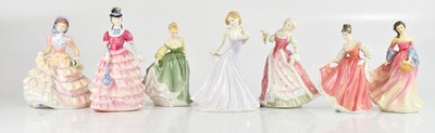 Lot 1124 - ROYAL DOULTON; seven assorted figures,...
