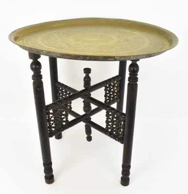 Lot 68 - A Middle Eastern circular engraved brass tray...
