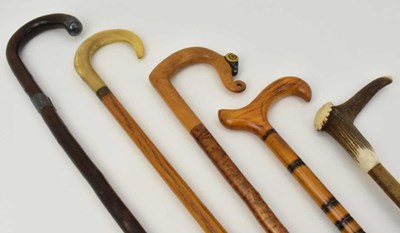 Lot 331 - A group of five walking sticks, one with...