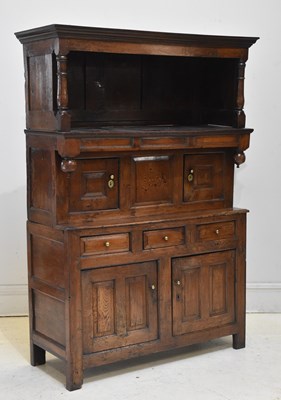 Lot 1046 - An early 18th century Welsh inlaid oak cwpwrdd...
