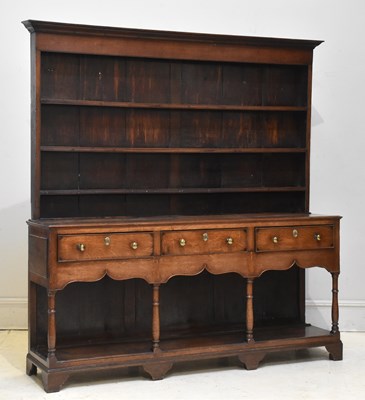 Lot 1047 - A George III mid Wales oak dresser, with...