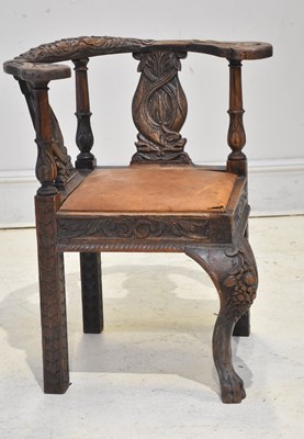 Lot 1175 - A 19th century carved oak corner chair/desk...